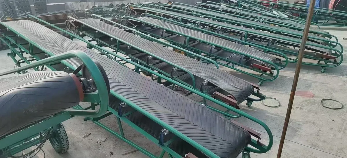 Rows of green belt conveyors in an outdoor assembly area